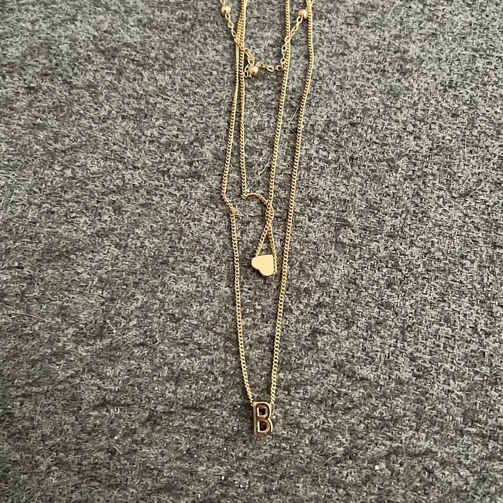 Multi-layered necklace with charm
